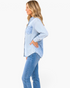 Beach Rose Co. light blue button-front shirt featuring mixed striped and washed denim-look panels on a model.