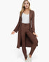 Beach Rose Co. model wearing a mocha brown ribbed long cardigan and matching leggings set over a white tank top.