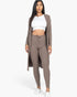 Beach Rose Co. mocha ribbed long cardigan and matching leggings set worn by a model with a white crop top