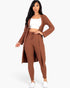 Beach Rose Co. ribbed long cardigan and leggings set in mocha brown worn by a model with a white crop top