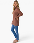 Beach Rose Co. model wearing a mocha brown ribbed turtleneck tunic sweater with side slits and blue jeans