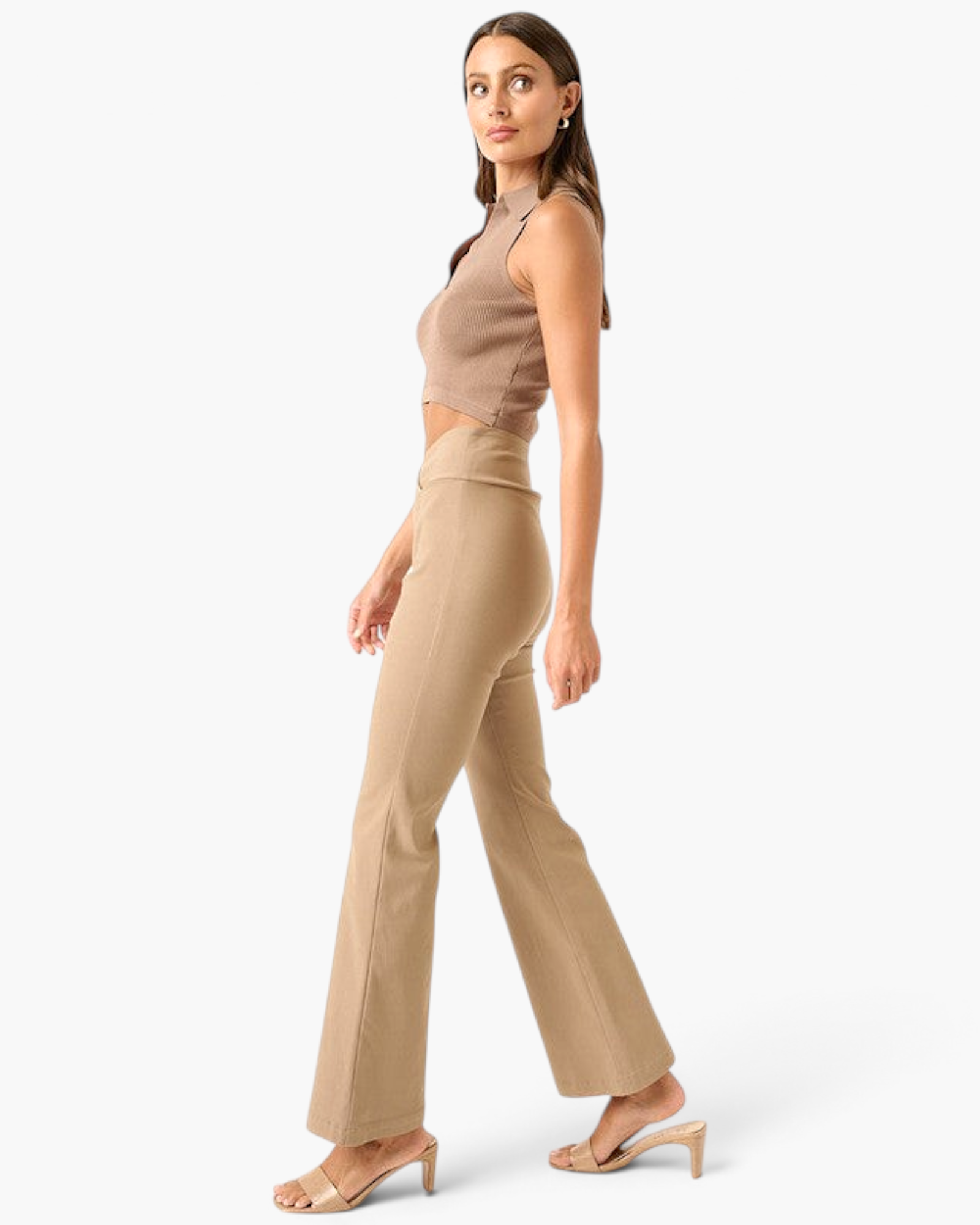 Model wearing Beach Rose Co. mocha high-rise flare pants with a crossover V-waist and stretch fabric, side view.