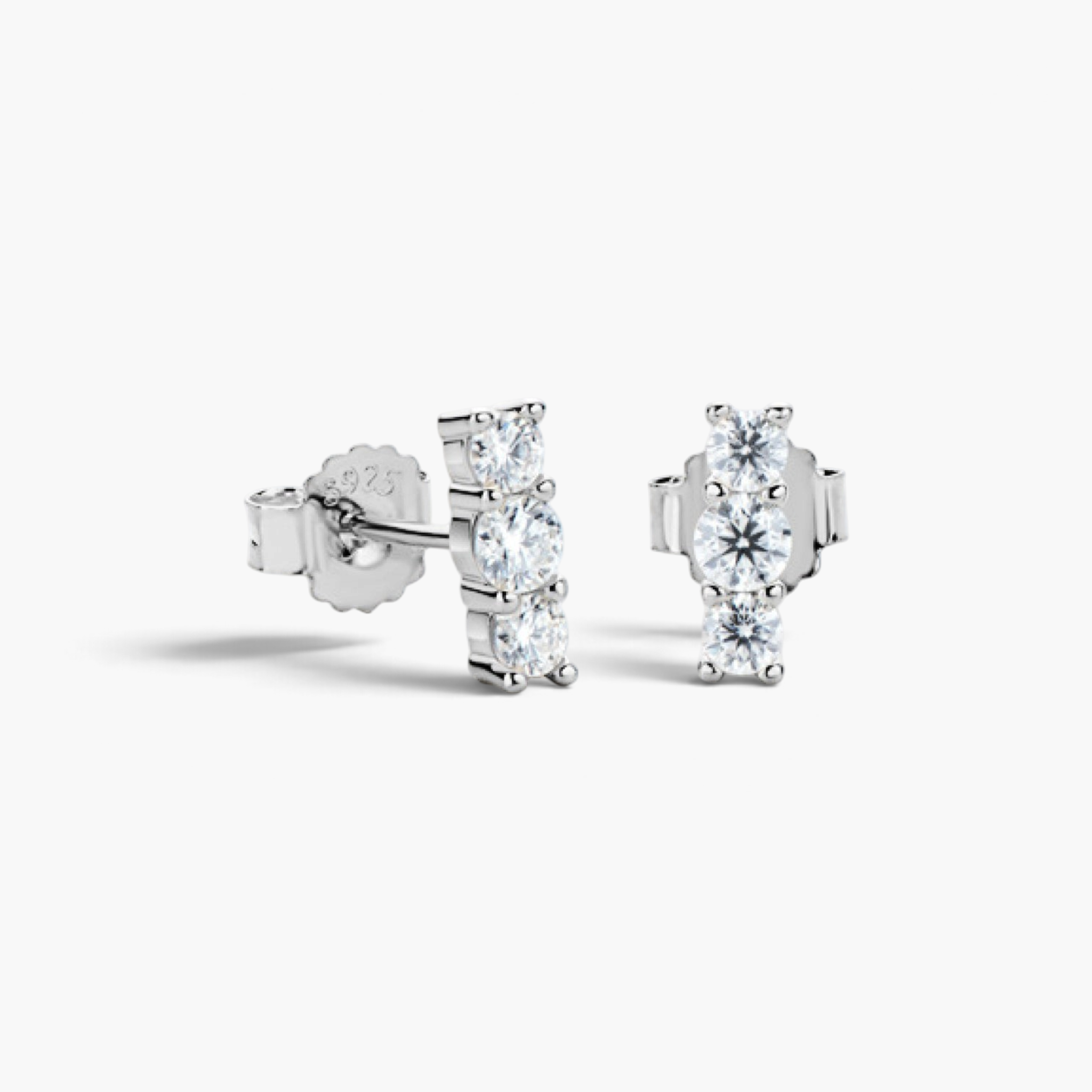 Beach Rose Co. three-stone moissanite bar stud earrings in sterling silver with a vertical row of round stones.