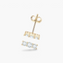 Beach Rose Co. gold-plated sterling silver bar stud earrings featuring three round moissanite stones in prong settings.
