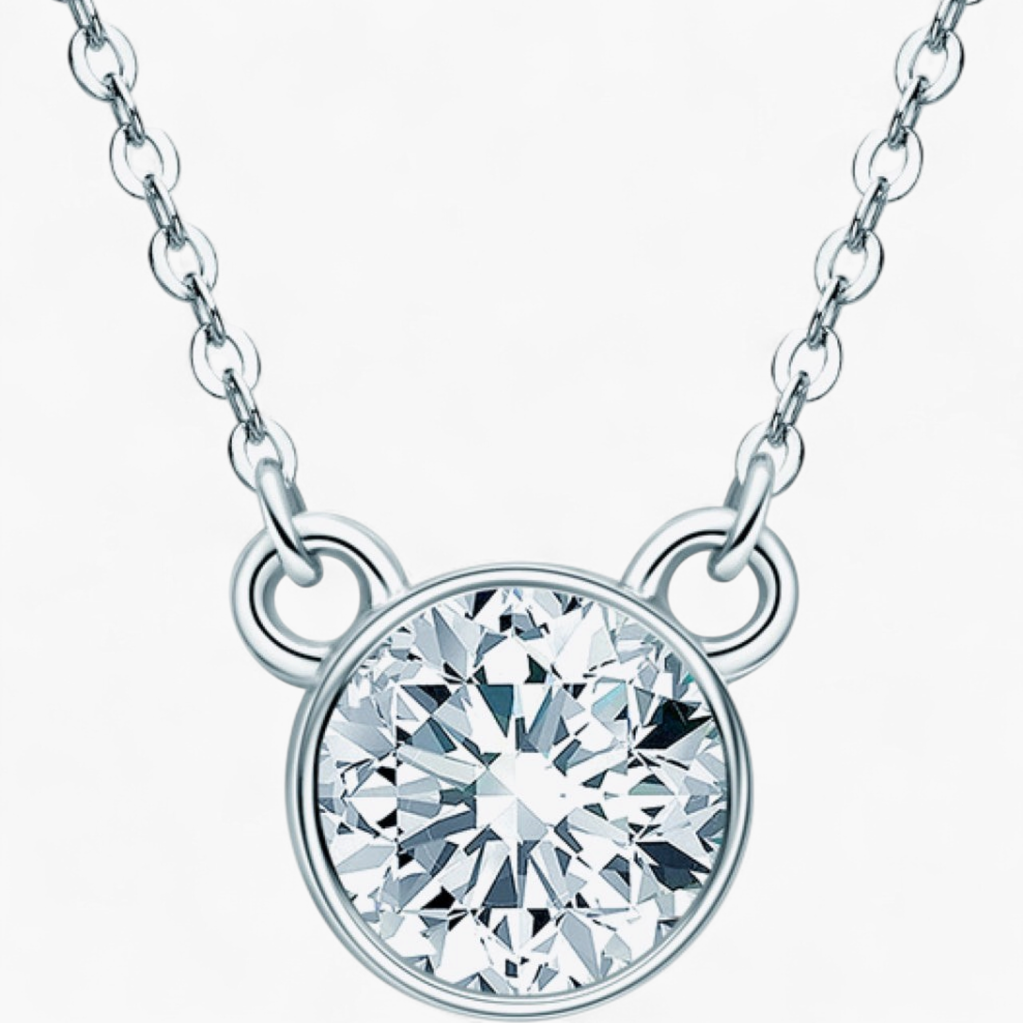 Beach Rose Co. 1 carat round moissanite solitaire necklace in a silver bezel setting on a delicate link chain