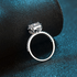 Beach Rose Co. 1 carat round moissanite square halo ring in sterling silver with zircon accents and openwork detail