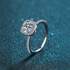Beach Rose Co. 1 carat round moissanite ring with a square halo and zircon accents in rhodium-plated sterling silver.