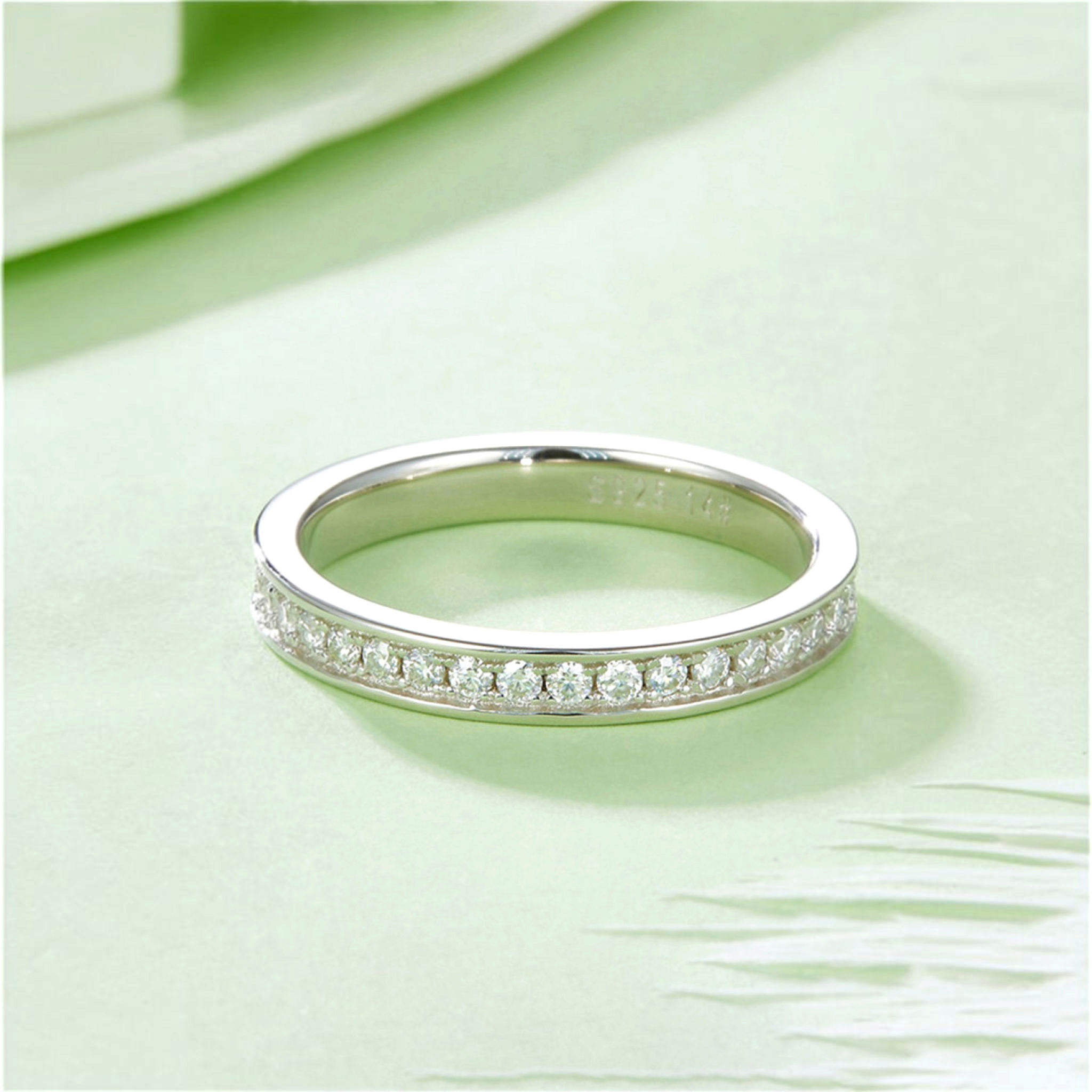 Beach Rose Co. 0.57 carat moissanite band ring in platinum-plated sterling silver with a sleek polished finish.