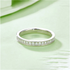Beach Rose Co. 0.57 carat moissanite band ring in platinum-plated sterling silver with a sleek polished finish.