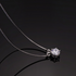 Beach Rose Co. 1 carat round moissanite solitaire pendant necklace in sterling silver with a delicate box chain.