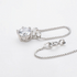 Beach Rose Co. 1 carat round moissanite solitaire pendant necklace in sterling silver with a delicate box chain.