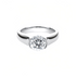 Beach Rose Co. 2 carat round moissanite solitaire ring in platinum-plated sterling silver with a half-bezel setting.