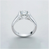 Beach Rose Co. 2 carat round moissanite solitaire ring in platinum-plated sterling silver with a half-bezel setting.
