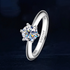 Beach Rose Co. 1 carat round moissanite solitaire ring in platinum-plated sterling silver with a six-prong setting.