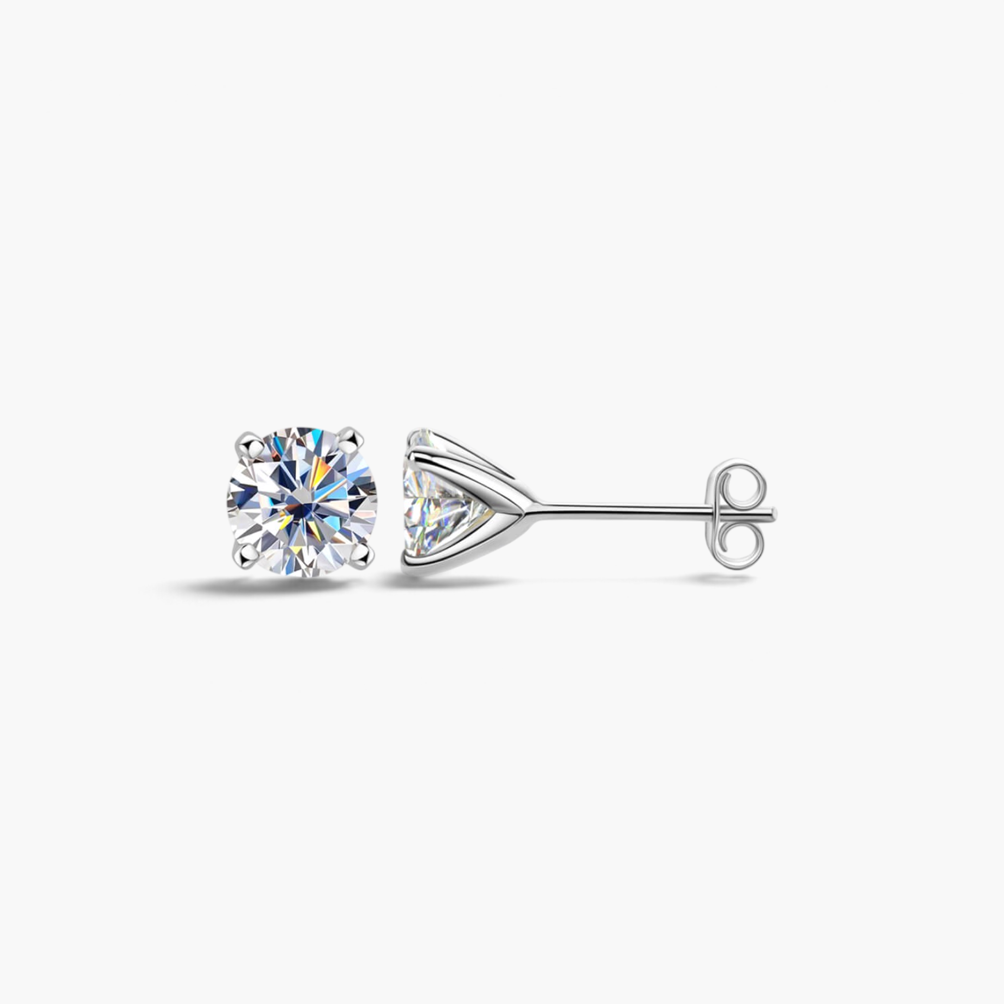 Beach Rose Co. 1 carat round moissanite stud earrings in a four-prong sterling silver setting with butterfly backs.