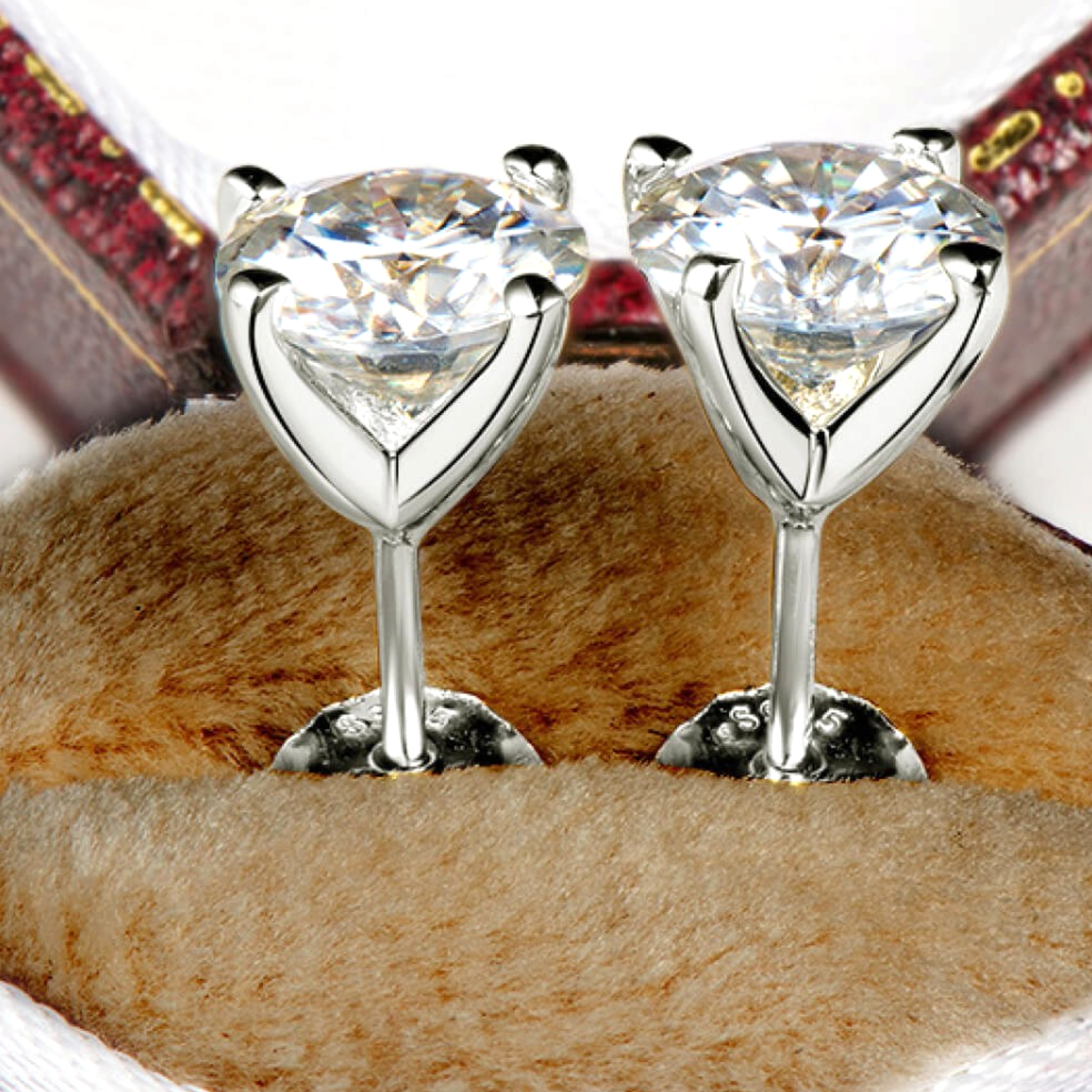 Beach Rose Co. 1 carat round moissanite stud earrings in sterling silver with four-prong open basket settings