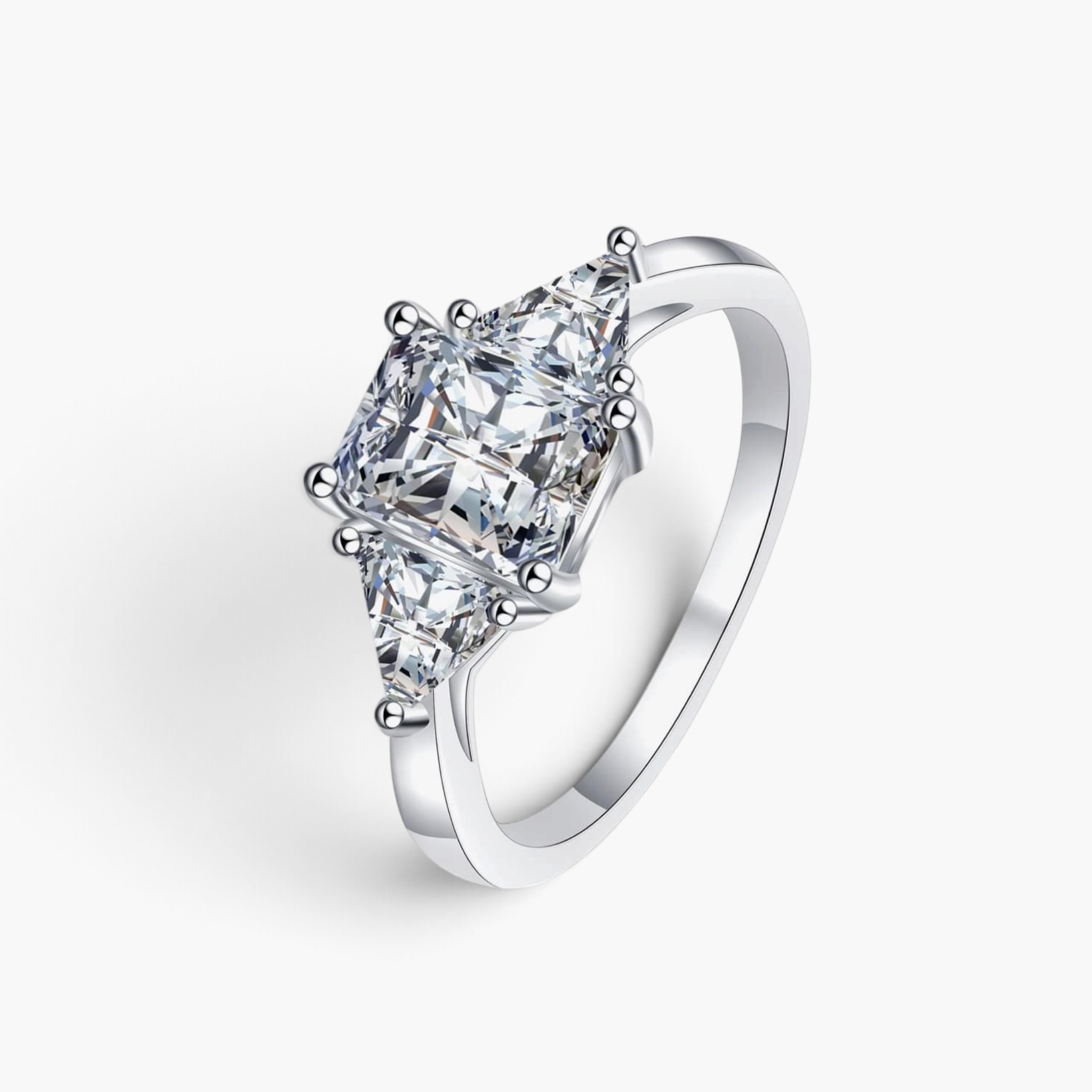 Beach Rose Co. 3 carat moissanite three-stone ring in rhodium-plated sterling silver with square and triangular cuts.
