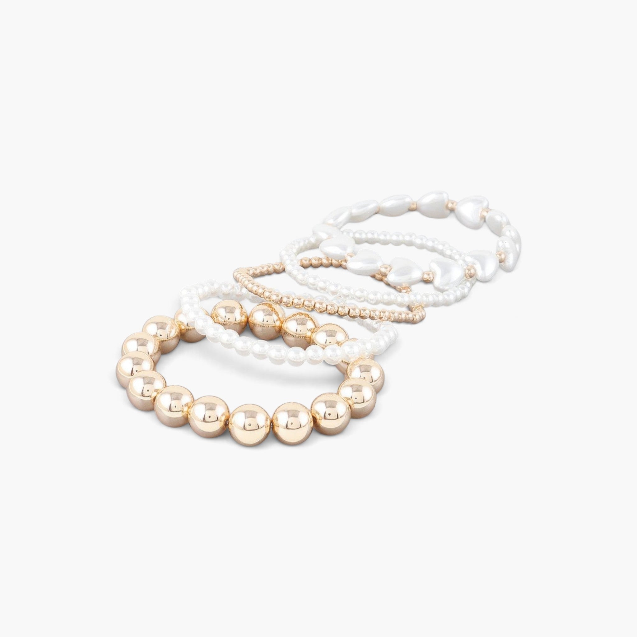Beach Rose Co. multi-strand beaded bracelet set featuring gold spheres, cream heart stones, and delicate pearl beads.