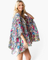 Beach Rose Co. model wearing a lightweight, flowy multicolor snake print kimono with an open-front draped design.