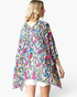 Beach Rose Co. multicolor snake print kimono with an asymmetrical hem and flowy oversized fit worn by a model