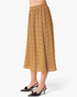 Beach Rose Co. mustard midi skirt with a geometric print, elastic waistband, and flowy gathered silhouette.