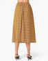 Beach Rose Co. mustard midi skirt with a geometric print, elastic waistband, and flowy silhouette, back view.