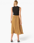 Beach Rose Co. mustard midi skirt with geometric print, elastic waistband, and flowy silhouette, back view.