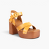 Beach Rose Co. yellow leather platform sandals with cross-strap design, silver stud accents, and block heel.