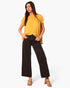 Beach Rose Co. mustard yellow washed poly silk tulip tunic top worn by a model with black wide-leg trousers.