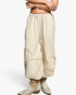 Beach Rose Co. natural cotton double-gauze jogger pants with raw-edge patches and studded side seams.
