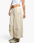 Beach Rose Co. natural cotton double-gauze jogger pants with studded side seams and raw-edge patch details