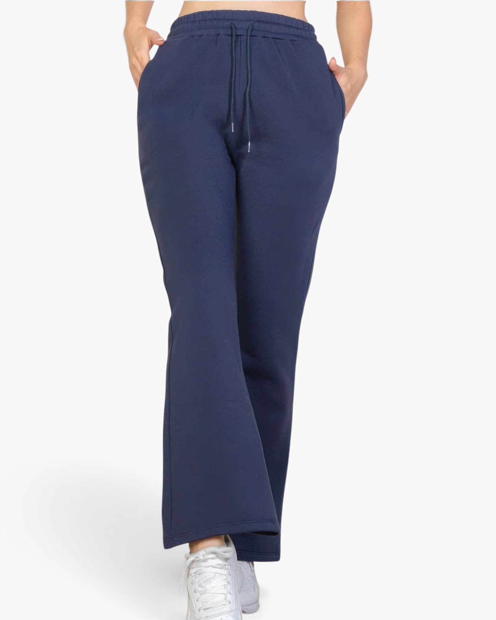Beach Rose Co. navy blue bootcut sweatpants with a drawstring waist and slant pockets on a model