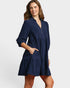 Beach Rose Co. navy corduroy tiered mini dress with collared split neckline, puff sleeves, and side pockets.