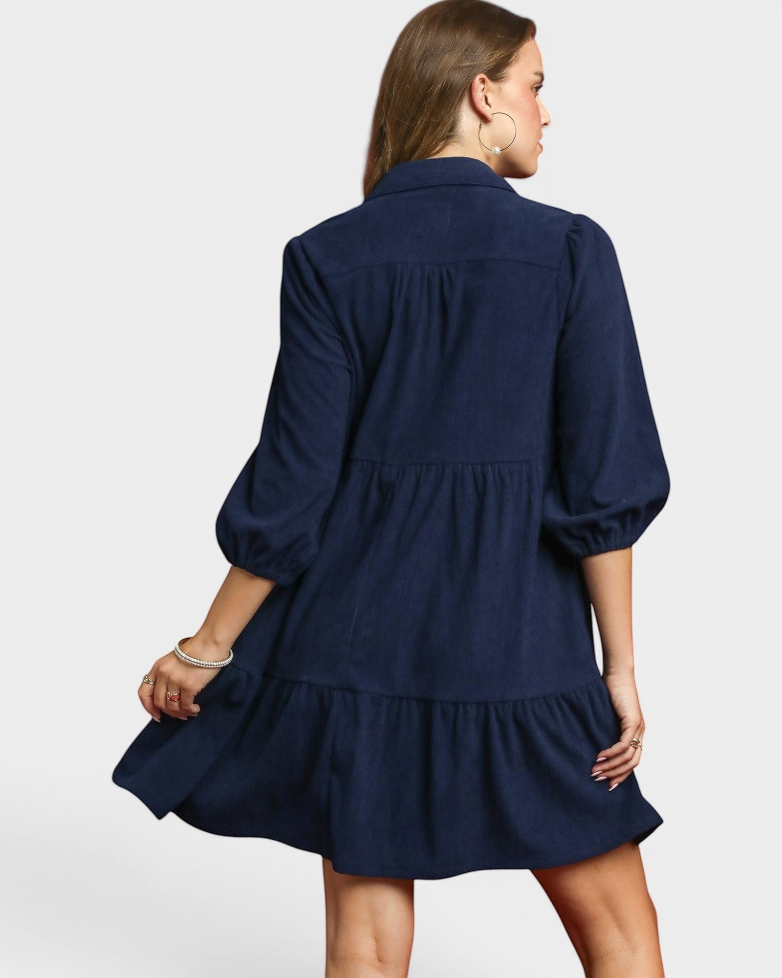Beach Rose Co. navy corduroy tiered mini dress with puff sleeves and side pockets, perfect for fall.