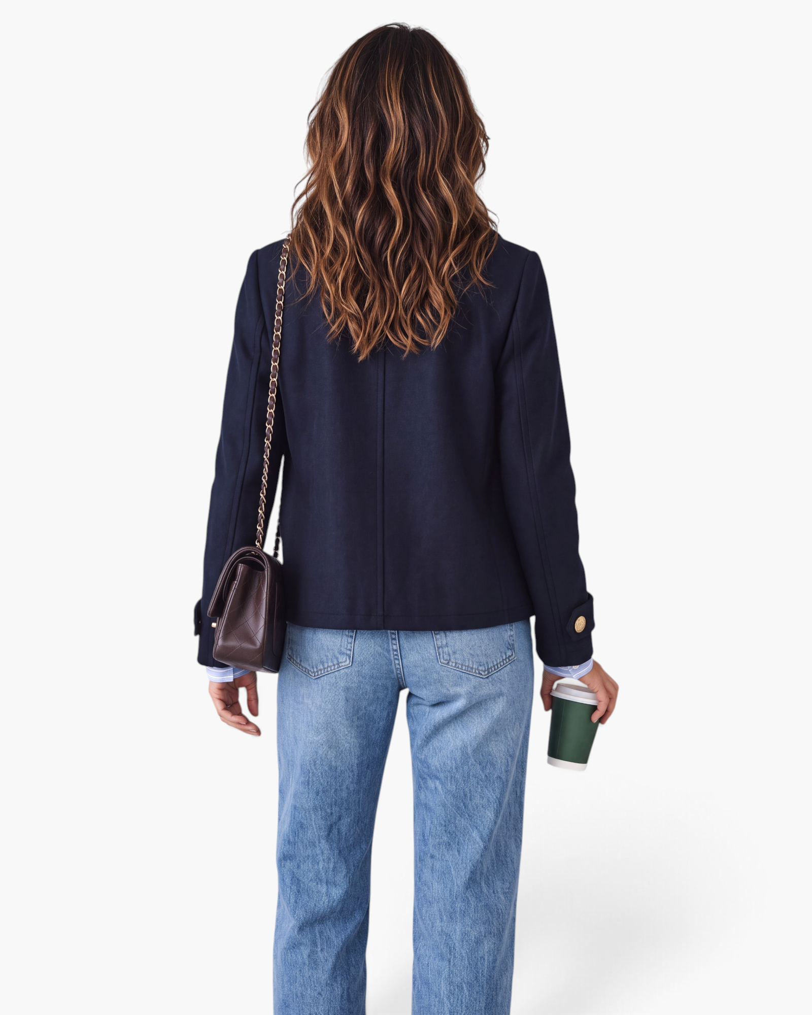 Beach Rose Co. navy double-breasted jacket with gold buttons worn by a woman with wavy hair, back view