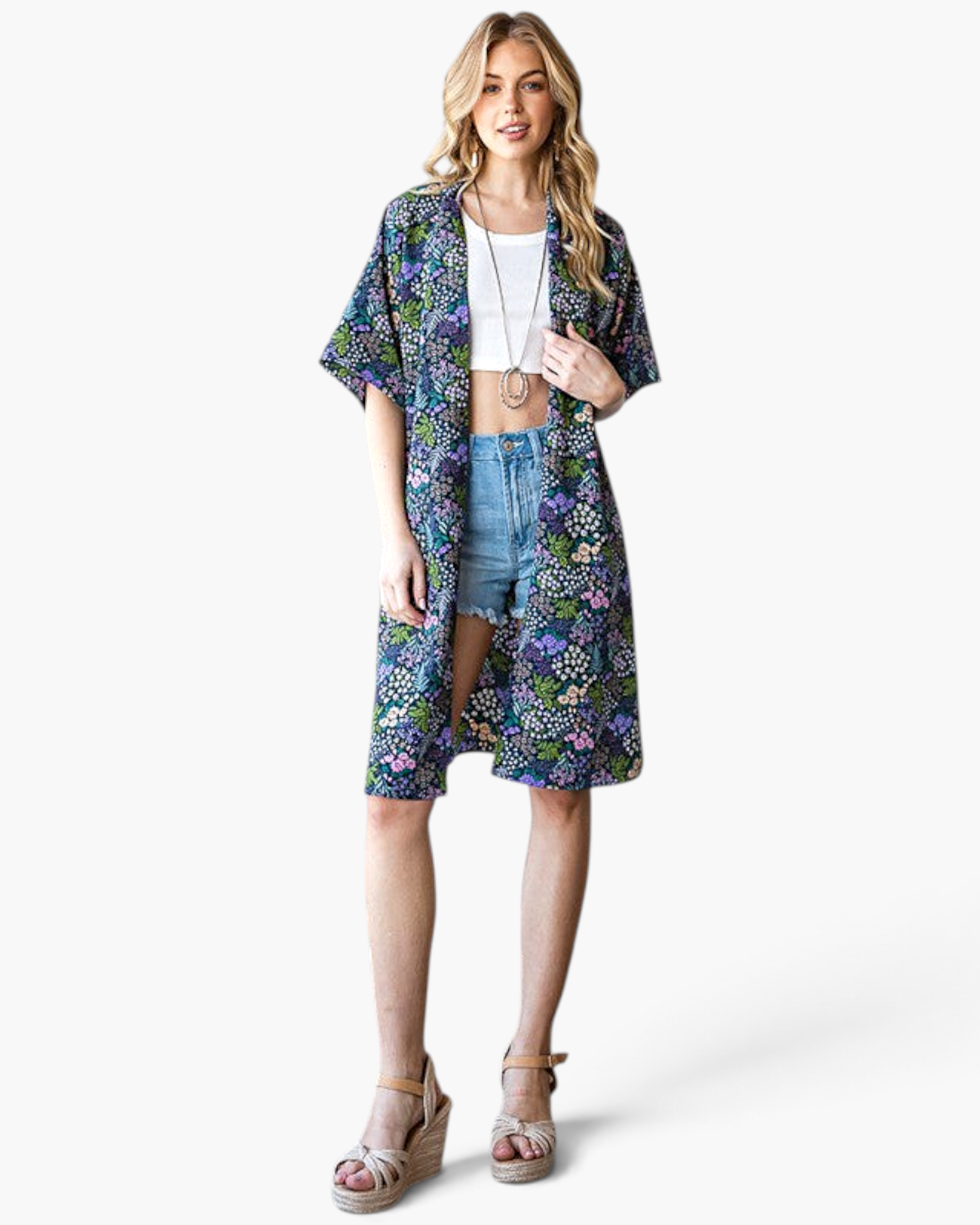 Beach Rose Co. navy longline kimono with a colorful floral print, open front, and relaxed fit worn by a model.