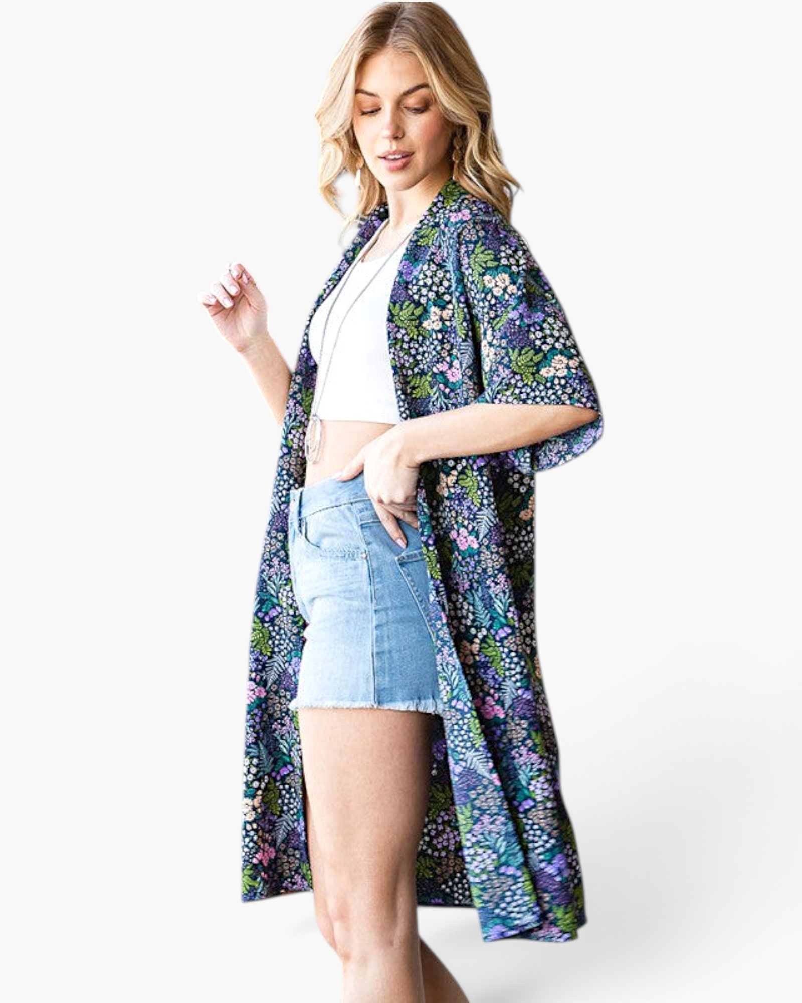 Beach Rose Co. navy longline kimono with a colorful floral print, open front, and relaxed fit worn over denim shorts.