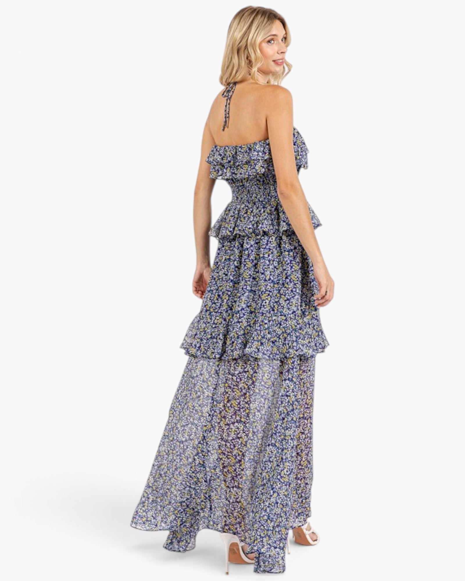 Beach Rose Co. dark navy floral maxi dress with halter tie, smocked bodice, and cascading ruffles on a blonde model