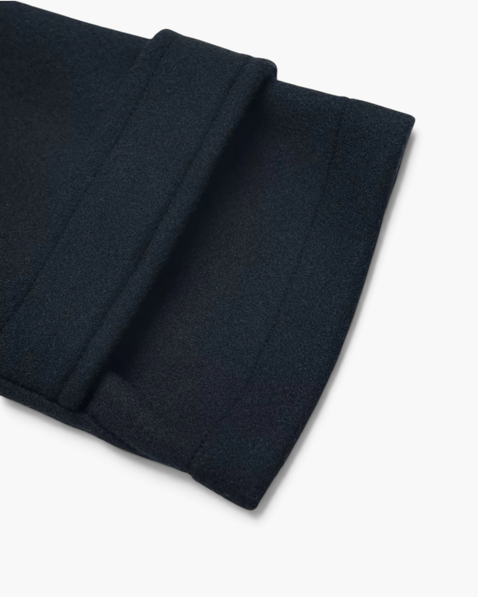 Beach Rose Co. navy polyester jacket sleeve with a tailored button-tab cuff detail.