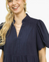Beach Rose Co. navy linen blend mini dress with a stand collar, split V-neck, and scalloped puff sleeves