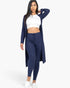 Beach Rose Co. navy blue ribbed long cardigan and leggings set worn by a model with a white crop top