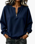 Beach Rose Co. navy blue ribbed quarter-zip pullover with dropped shoulders and a relaxed fit worn by a woman.