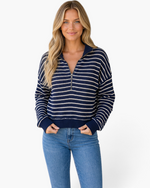 Beach Rose Co. model wearing a navy and oatmeal textured striped quarter-zip pullover with a relaxed fit.