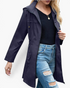 Beach Rose Co. navy waterproof hooded rain jacket with zip front, drawstring hood, and gathered waist on a model