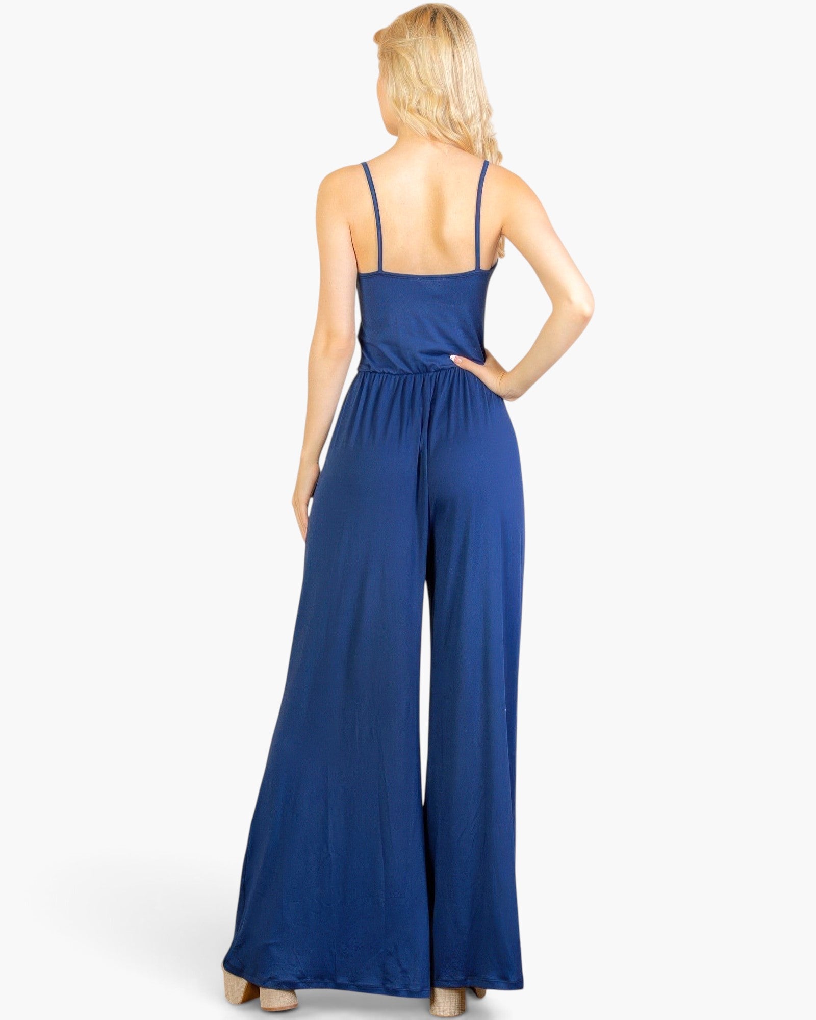 Beach Rose Co. navy blue wide-leg jumpsuit with spaghetti straps and a stretchy jersey fabric, back view