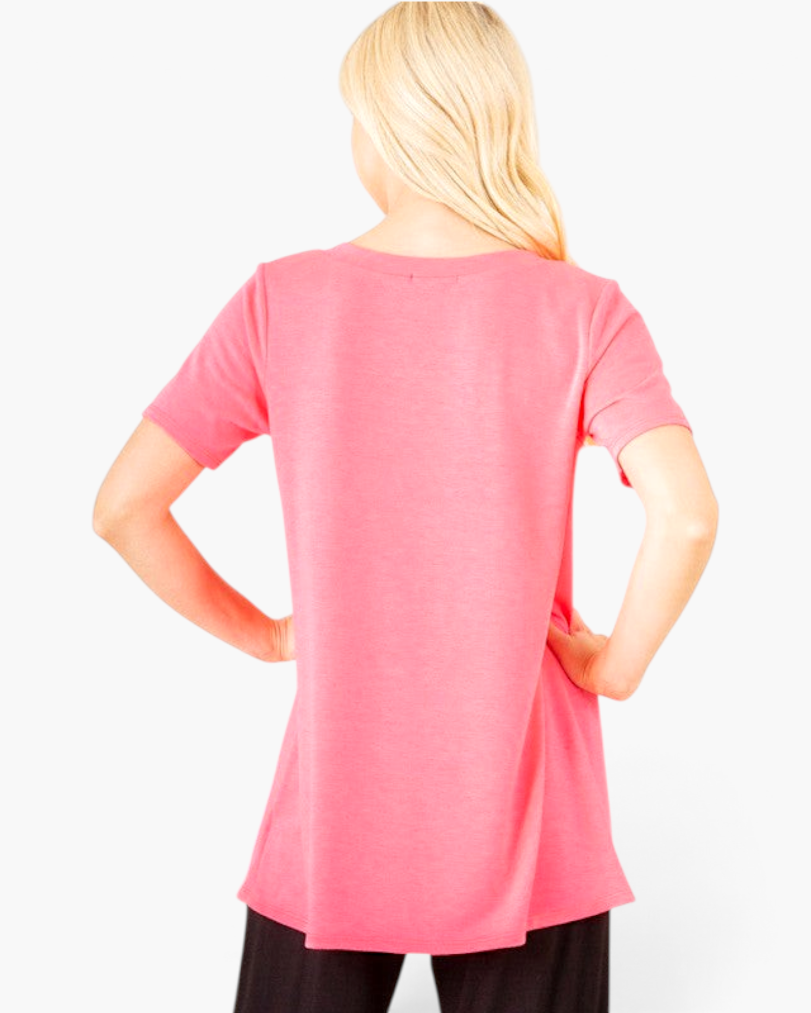 Back view of a Beach Rose Co. neon pink short-sleeve tunic top with a relaxed A-line fit on a blonde model.