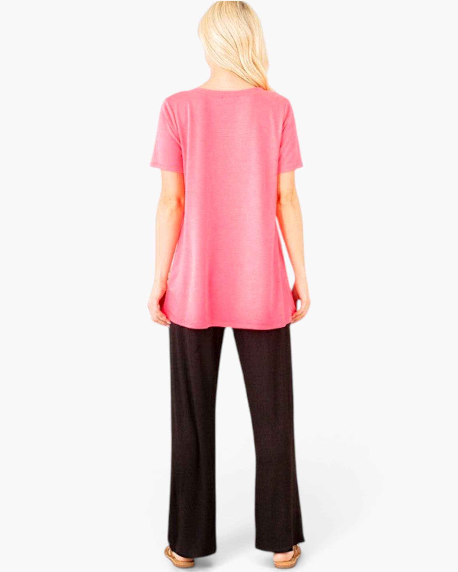 Beach Rose Co. neon pink tunic top with a relaxed A-line silhouette worn by a blonde model from the back view
