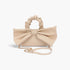 Beach Rose Co. nude nylon clutch with a large front bow, ruched top handle, and detachable gold chain shoulder strap.