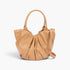 Beach Rose Co. nude faux leather tote bag with stylish ruched detailing and sturdy handles on a white background