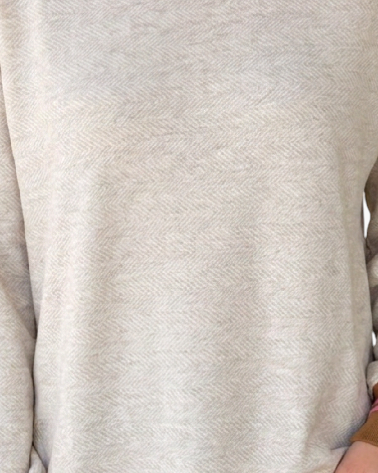 Beach Rose Co. oatmeal textured sweatshirt with a subtle herringbone pattern and pink and brown striped cuff detail.